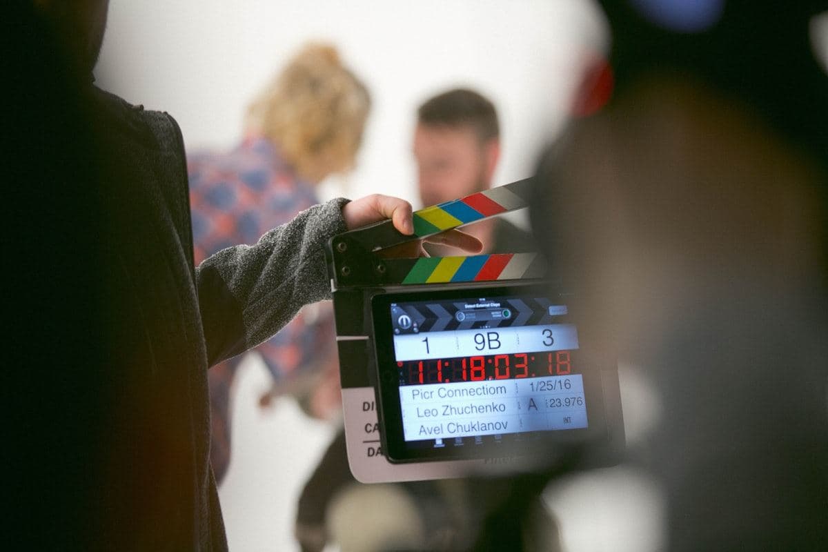 Clapperboard held in front of a camera