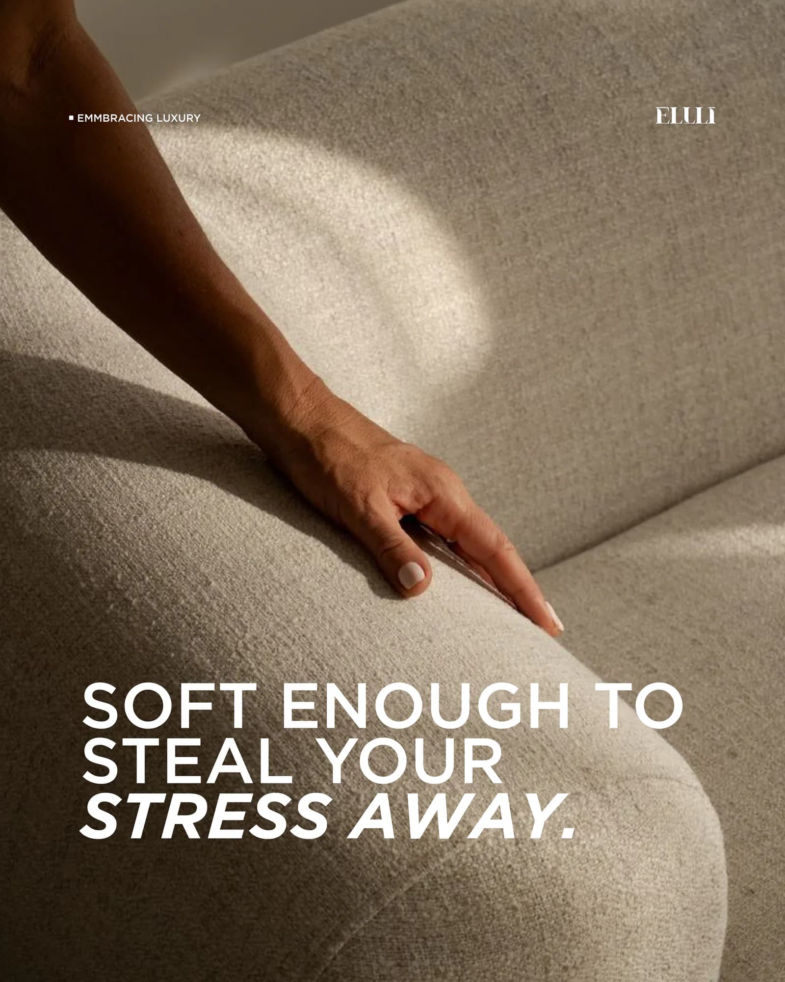 Close detail of a hand pressed into a soft upholstered cushion