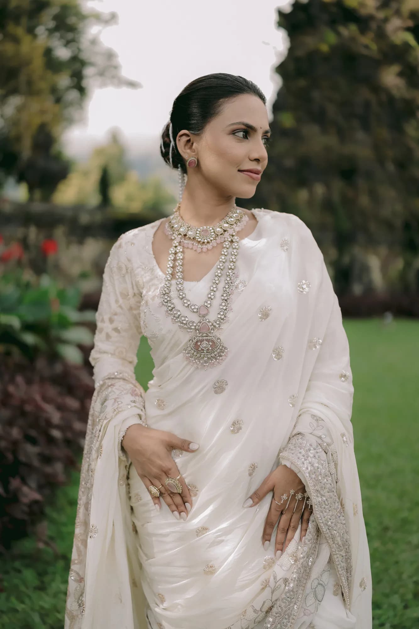Portrait of a bride in an ivory embroidered saree