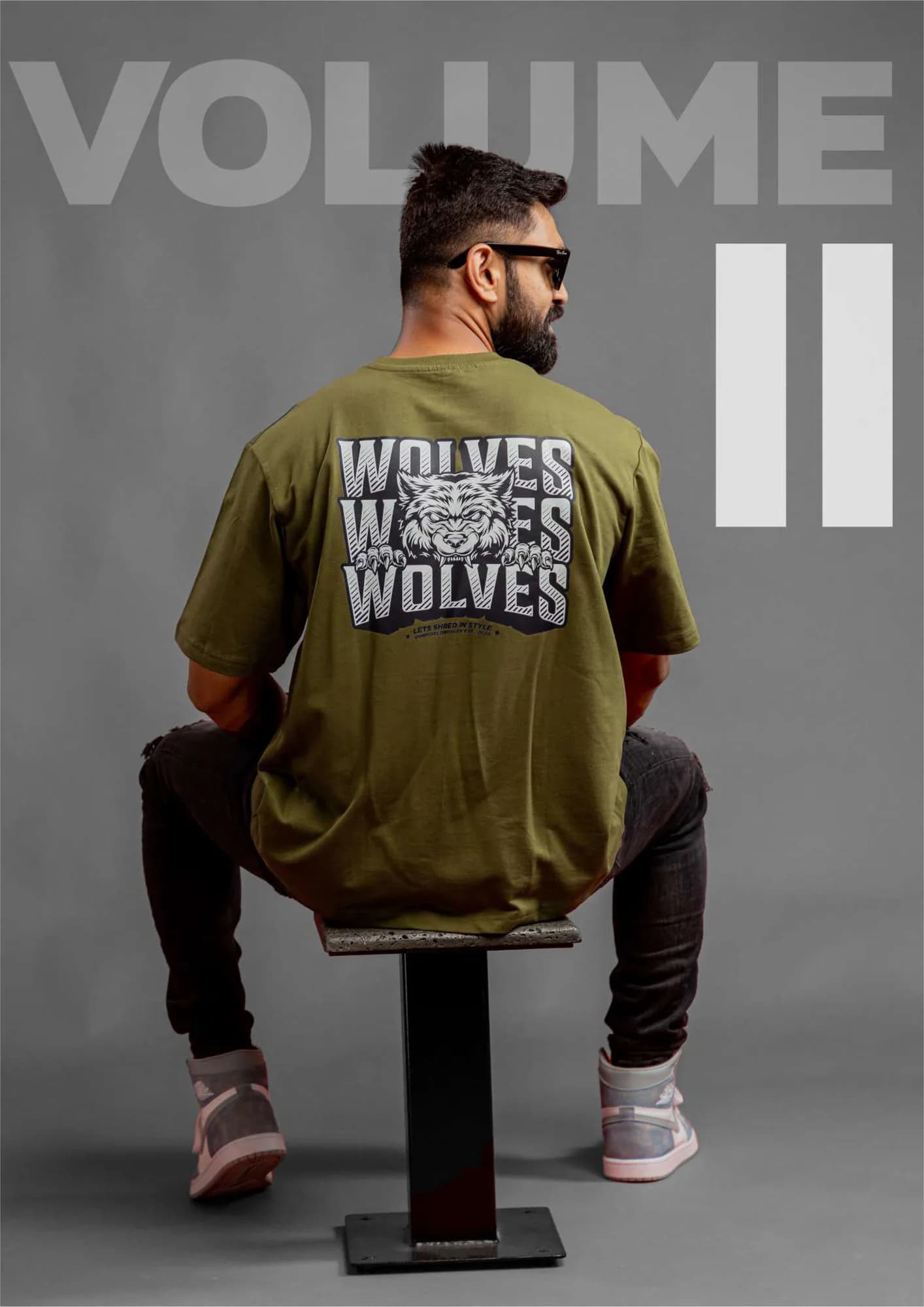 Brand book spread — an athlete in a graphic tee under the words Volume II