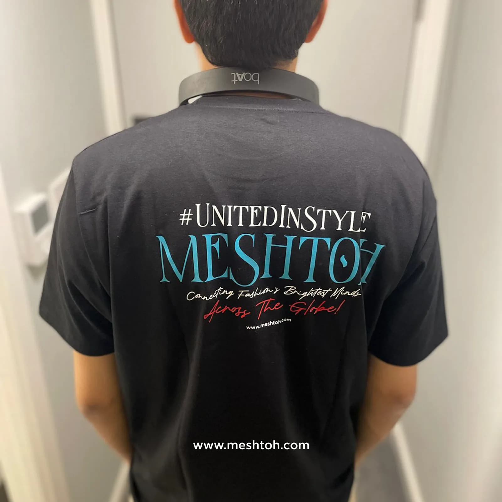 Detail of the campaign print on the back of a branded polo